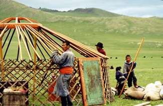 People building a primitive hut
