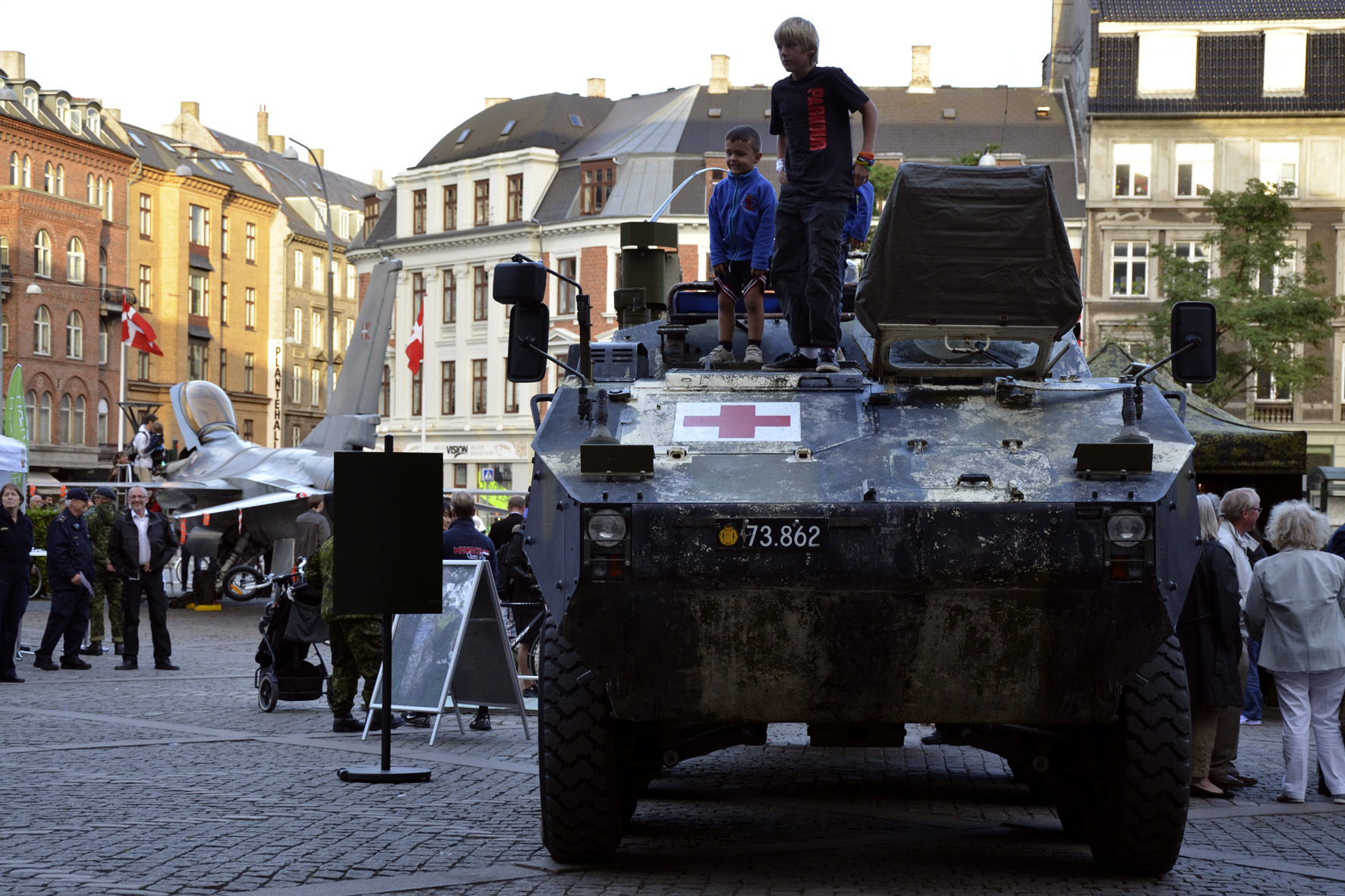 Boys on top of an armored Piranha ambulance on display at the town hall square of Frederiksberg. Photo by Thomas Randrup Pedersen