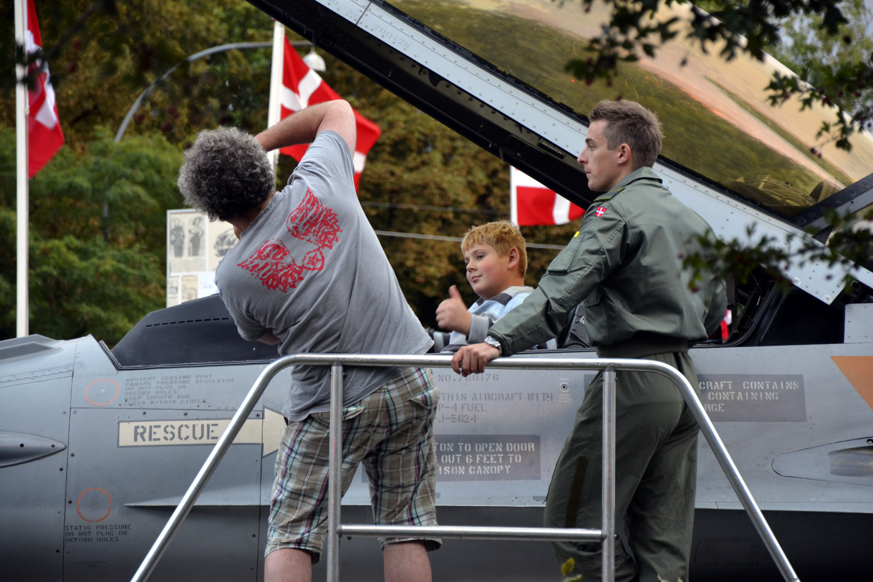 A boy tries out sitting in the cockpit of a F-16 Fighting Falcon displayed at Frederiksberg town hall square. Photo by Thomas Randrup Pedersen 